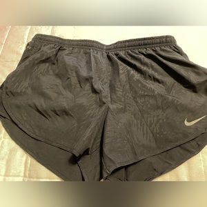 Ladies Nike run shorts. Black with soft pattern. Large like new.